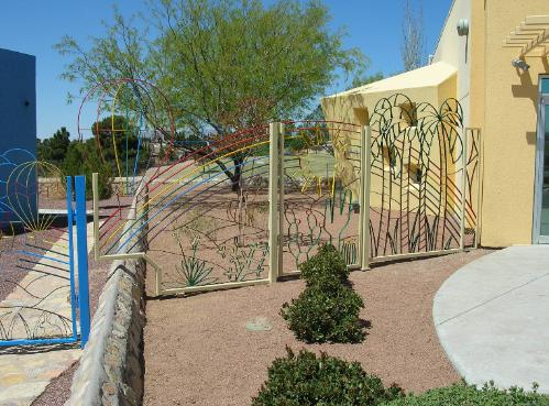 palm tree rainbow fence and gate
